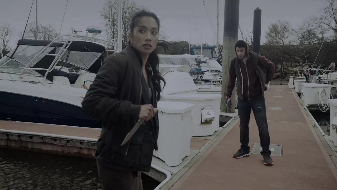 Day 34 — a figure on a marina dock at dusk